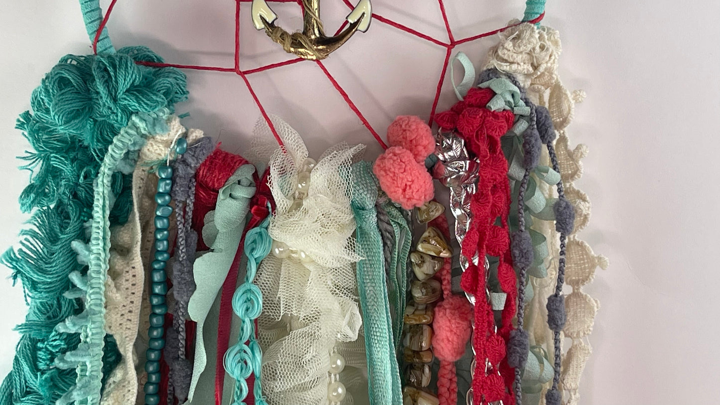 Colorful ribbons arranged on a dreamcatcher with a white background